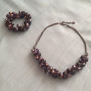 Purple beaded necklace and matching bracelet set.